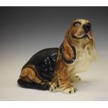 Large 20th Century pottery Basset Hound, in recumbent pose, 32cm x 34cm wide