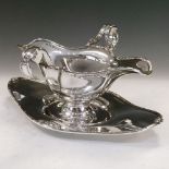 George V silver double-lipped sauce boat with twin handles and oval foot, Birmingham 1916, on