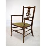 Edwardian mahogany and bone inlaid elbow chair having pierced splat and upholstered seats