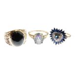 Two 9ct gold rings, the first with red garnet-coloured oval cabochon, size P, the second set with