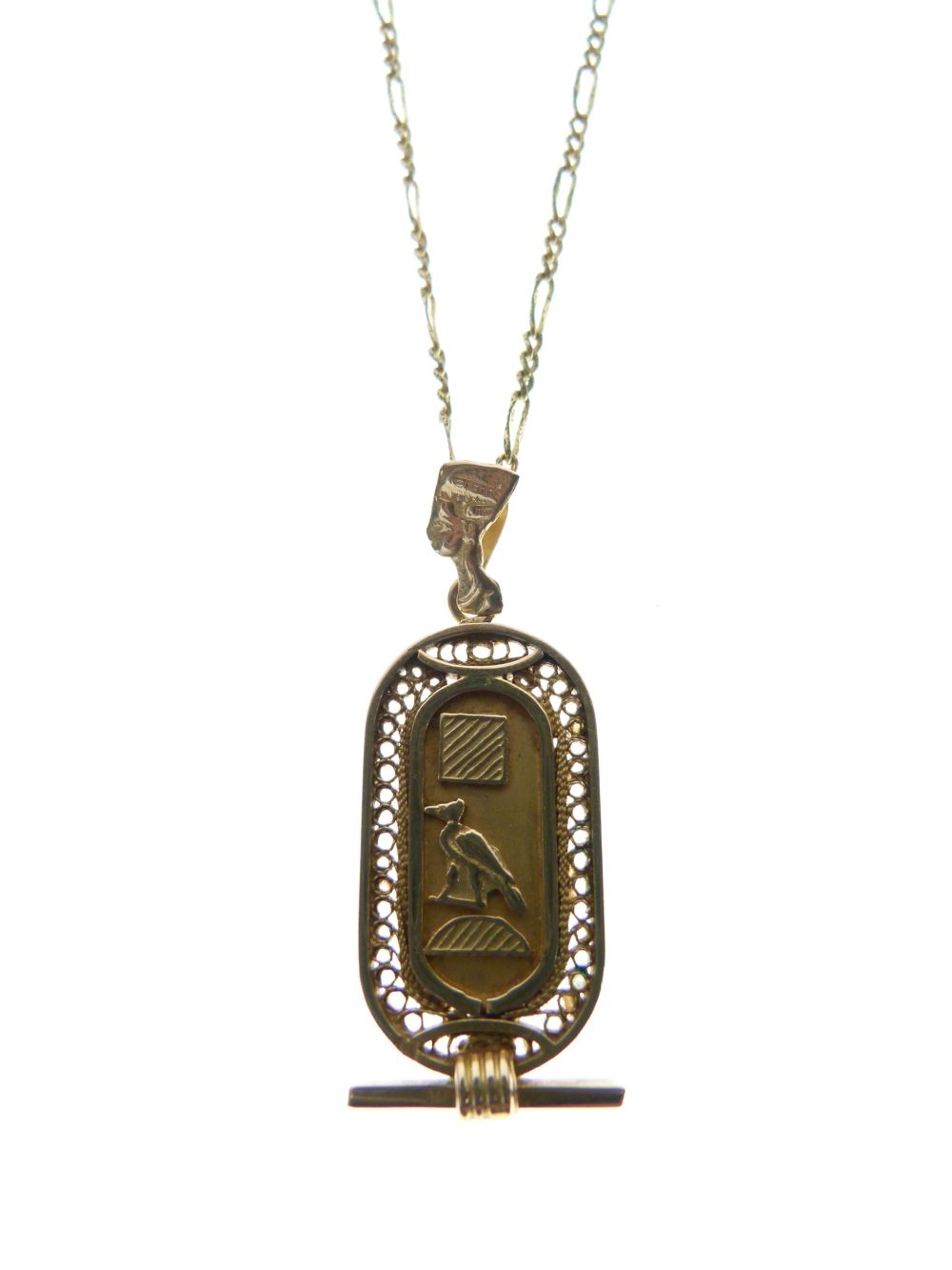 Egyptian yellow metal pendant decorated with hieroglyphics, 5.3g approx, together with an unmarked