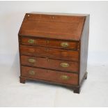 George III oak bureau, the fitted interior with book pilasters flanking a cupboard modelled as a