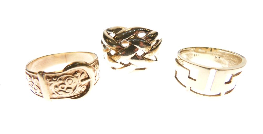 Two gentlemen's 9ct gold rings, one formed as a buckled belt, another with knot-work design, and a