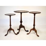 Old reproduction mahogany tripod wine table having a wavy pie-crust top on turned and gadrooned stem
