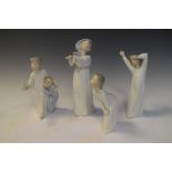 Group of four Lladro porcelain figurines of sleepy children, tallest 25cm high
