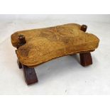 Camel stool having tooled leather seat, 60cm wide