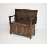 20th Century stained beech and oak monks bench having folding back/top and box seat, 100cm wide