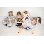 Assorted collection of bisque headed children's dolls, in various style dresses, no markings to