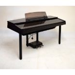 Yamaha Clavinova CVP70 in black ash finish case, raised on cylindrical supports, together with stool