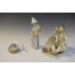 Group of four Lladro porcelain figures comprising two children seated, mother duck with ducklings in