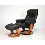 Ekornes Stressless black leather armchair and matching footstool