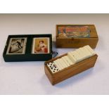 Assorted games to include; vintage playing cards, wooden chess pieces and dominoes