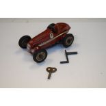 Vintage 20th Century Schuco Studio No.1050 red Mercedes clockwork racing car, 16cm long, with key