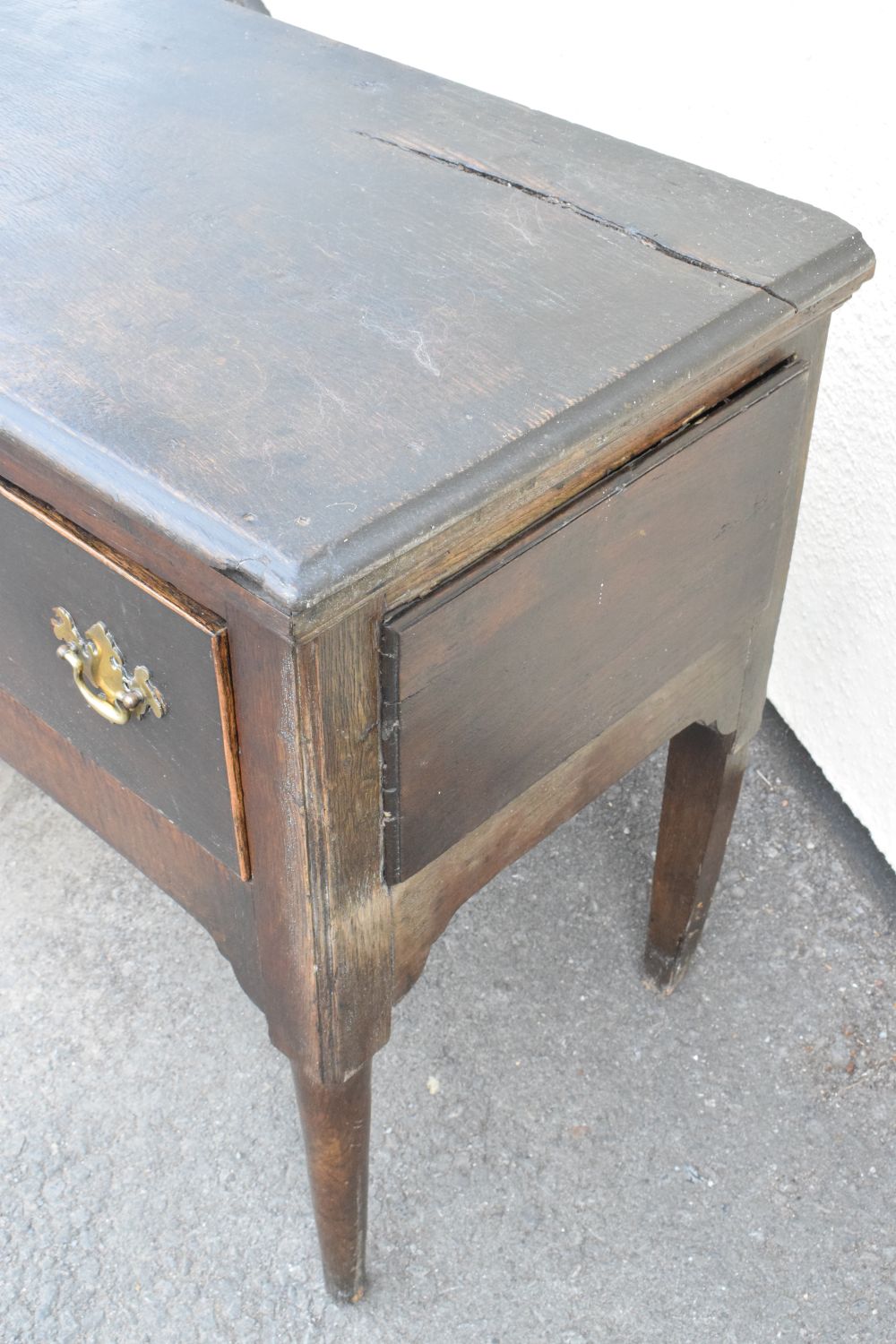 18th Century oak dresser base fitted three drawers with brass swan neck handles, raised on turned - Image 6 of 8