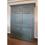 Antique painted pine two section cabinet, the upper fitted pair of twin panel doors enclosing