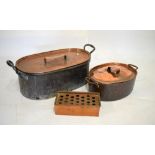 Large oval copper two handled vessel with cover, 67cm wide overall, one other smaller similar 43cm