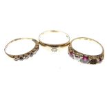 Dress ring set one diamond and three ruby coloured stones, the shank stamped 18ct, size S, a 9ct