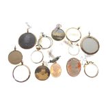 Quantity of double sided glass lockets in gold coloured metal mounts, some marked and two oval cameo