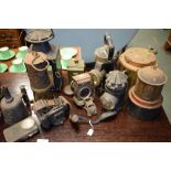 Collection of various lamps including miners lamps, bicycle lamps etc