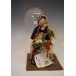 Old reproduction Pedler doll, under glass dome