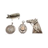 Silver sporting medallion, a white metal horse head brooch, base metal pig vesta and a Dutch one