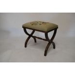 Mahogany X-frame stool having needlepoint seat, 50cm wide