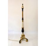 Polychrome decorated beech standard lamp having carved acanthus and fluted column, raised on