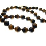 String of tigers-eye quartz beads, 104g gross approx