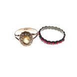 9ct gold dress ring set orange stone with seed pearl border, size N, 1911, together with a garnet
