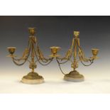 Pair of late 19th/early 20th Century gilt metal three branch candelabra on circular oval alabaster