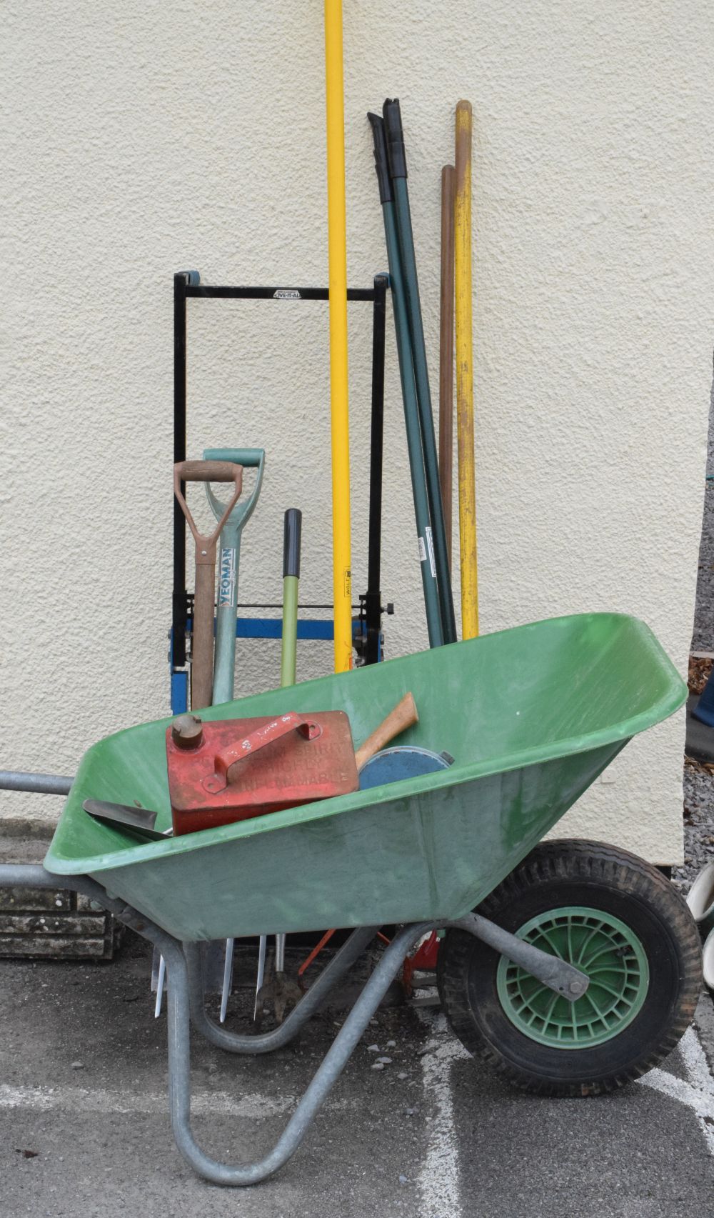 Assorted garden tools to include wheel barrow, sack trolley, fuel can, etc