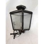 Early 20th Century wrought iron and black painted metal outdoor or garden lantern with integral