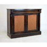 Mid 19th Century rosewood side cabinet, with cushion-moulded drawer over brass lattice doors