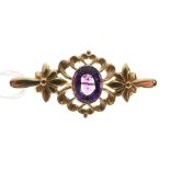 Unmarked yellow metal brooch set amethyst-coloured stone, 4.4cm wide, 5.2g gross approx
