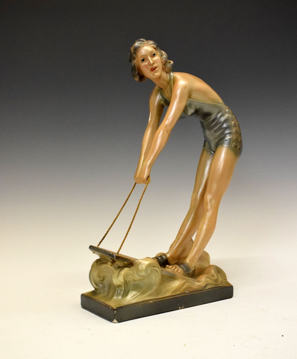 Art Deco-style composition figure of a lady surfing, impressed to base RD 623880m 38cm high
