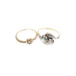Yellow metal ring of two stone crossover design set two white stones, shank stamped 18ct + pt., size