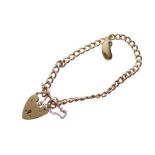 Yellow metal curb link bracelet with 9ct gold padlock and kidney bean charm, 20.6g gross approx