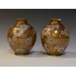 Pair of Japanese vases, having floral decoration on a brown and gold ground, 15cm high