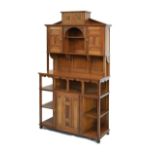 Late Victorian Aesthetic Period walnut salon cabinet of architectural form with carved flowerhead