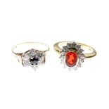 18ct gold dress ring set central red stone within a border of fourteen white stones, together with a