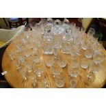 Large selection of cut glass table ware to include five decanters, assorted glasses etc