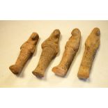 Four Egyptian-style Shabti, largest 17cm high, together with a group of terracotta sherds