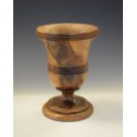 Treen (probably laburnum) goblet of inverted bell form on stepped foot, 14cm high