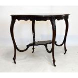 Edwardian carved mahogany occasional table of cartouche form on four leaf-carved cabriole