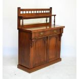 Late 19th Century walnut chiffonier with balustrade over mirror back and turned columns, the lower