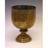 Indian bronze chalice cup with punched figural decoration on domed foot, 15cm diameter x 22.5cm high