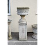 Large garden planter with lion mask and ring side handles on socle and pedestal, 54cm diameter x