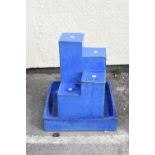 Modern blue-glazed pottery water feature of stepped design with rectangular trough base, 52cm high