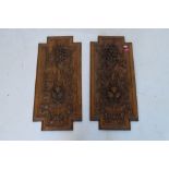 Two carved oak panels of grape and vine decoration, 66cm x 30cm