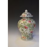Large Chinese lidded jar, having floral and peach decoration, marks to base, 39cm high